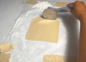 repeat rolling the dough and cut into rectangle shape until the dough is done