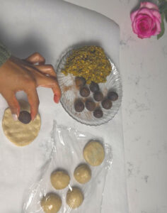 stuff the date filling inside of the prepared dough
