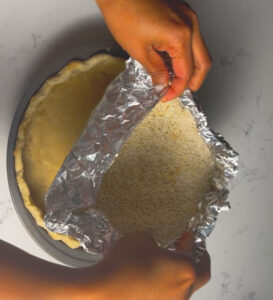 blind baking will help the crust to get crispy and not soggy