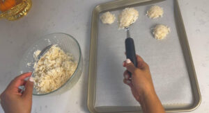 Scoop them into the baking sheet