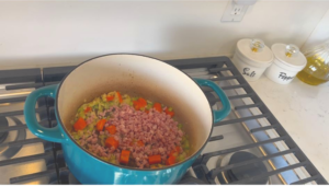 Add Chopped onion, chopped garlic, Diced Carrots, Diced Celery into the pot