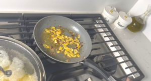 starting making the sauce by cooking garlic and red chili flake until fragrance 