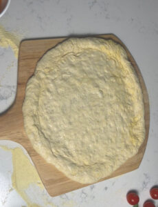 put it on the pizza peel and put topping on it