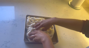 Try to spread around the dough with the tip of your fingers, don't completely press it, just spread it around.