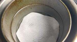 put parchment paper at the bottom of air fryer
