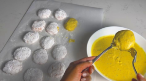 coat each nugget that already coated with cornstarch into the batter mixture, and lay them in the parchment paper.