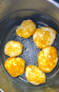 cook for 10 minutes and flip the other side of chicken nuggets and remove the parchment paper, continue cooking for another 10 minutes or until golden brown