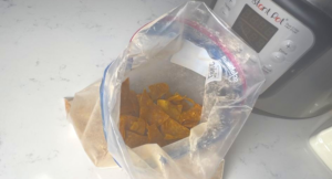 put the warm chips into the seasoning bag and shake it.